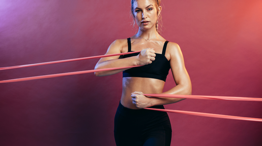 Fitness enthusiast using resistance band for strength training.